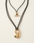 Large Gold-Tone Oval Pendant Necklace on Adjustable Black Cord - photo 2