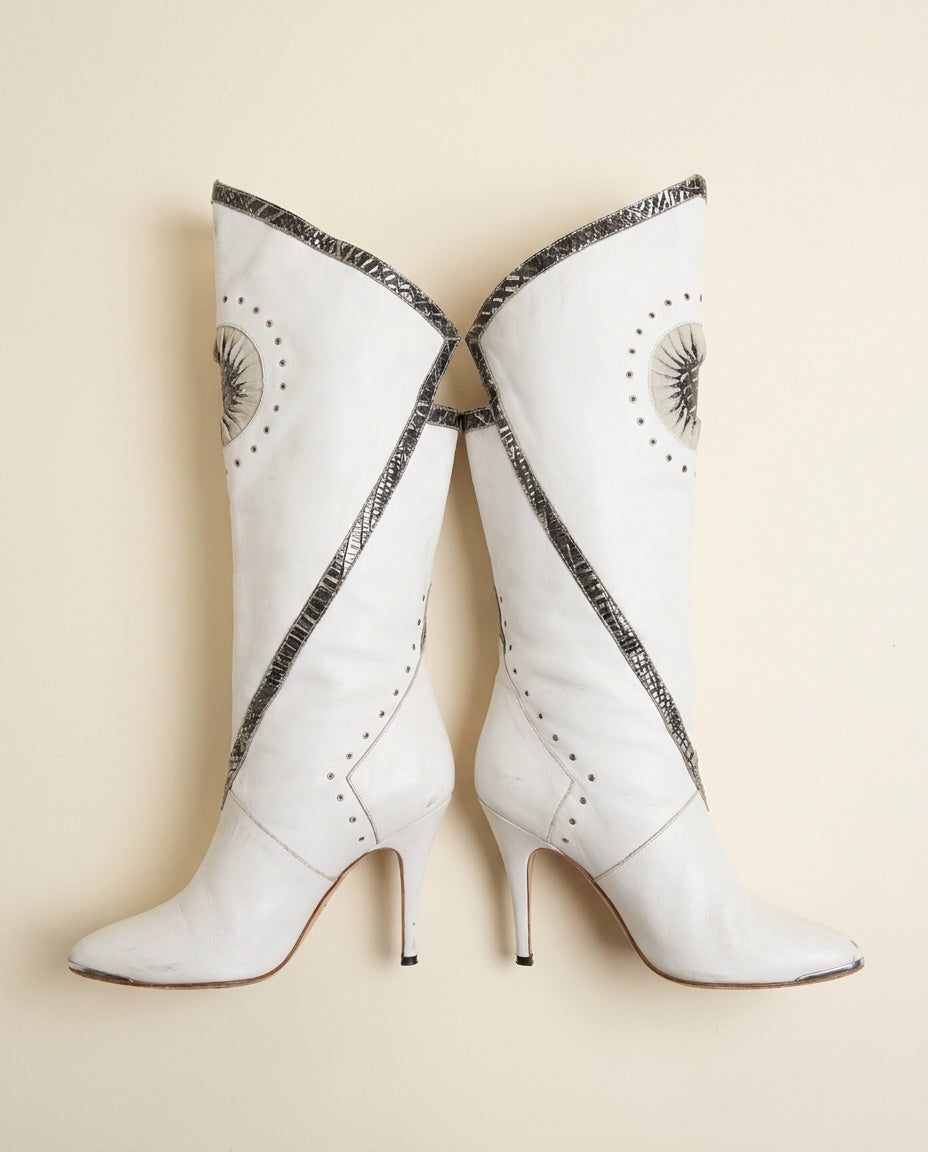 White Knee-High Stiletto Heeled Boots with Sunburst Appliqués and Embossed Trim - photo 1