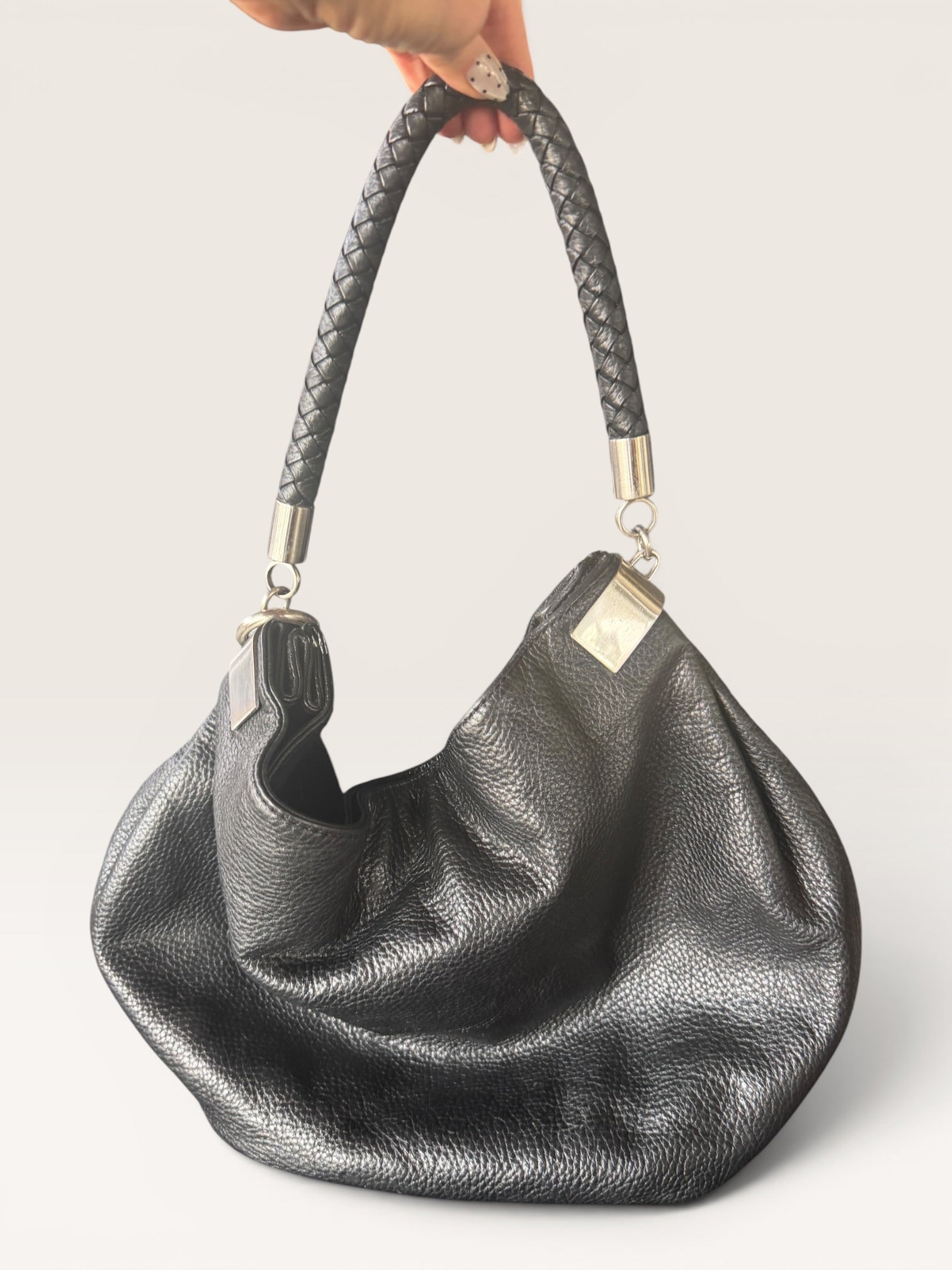 Black Leather Hobo Bag with Braided Handle and Tassel Detail