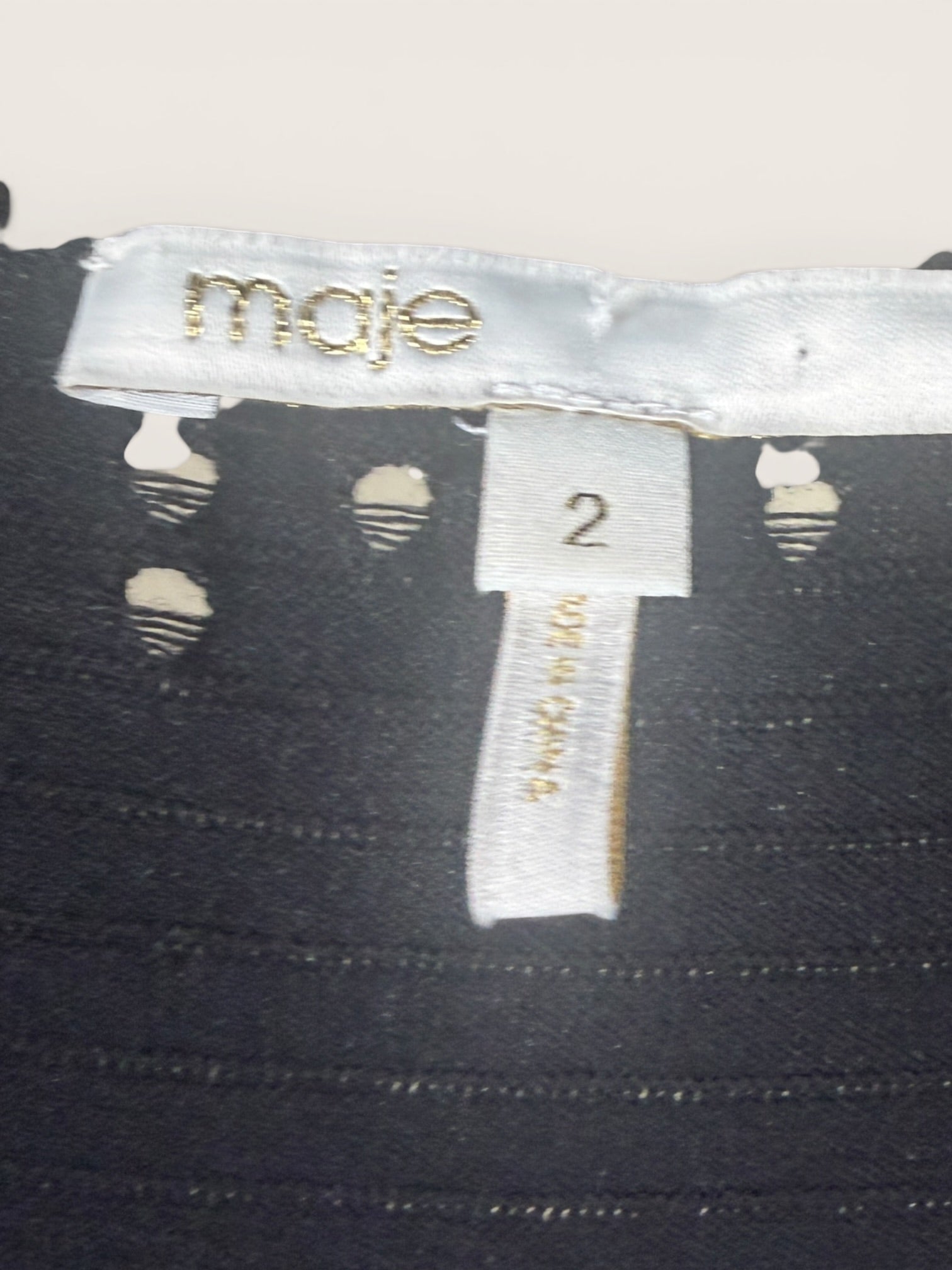 Maje Black Ribbed Knit Dress with Ruched Bodice and Flared Skirt