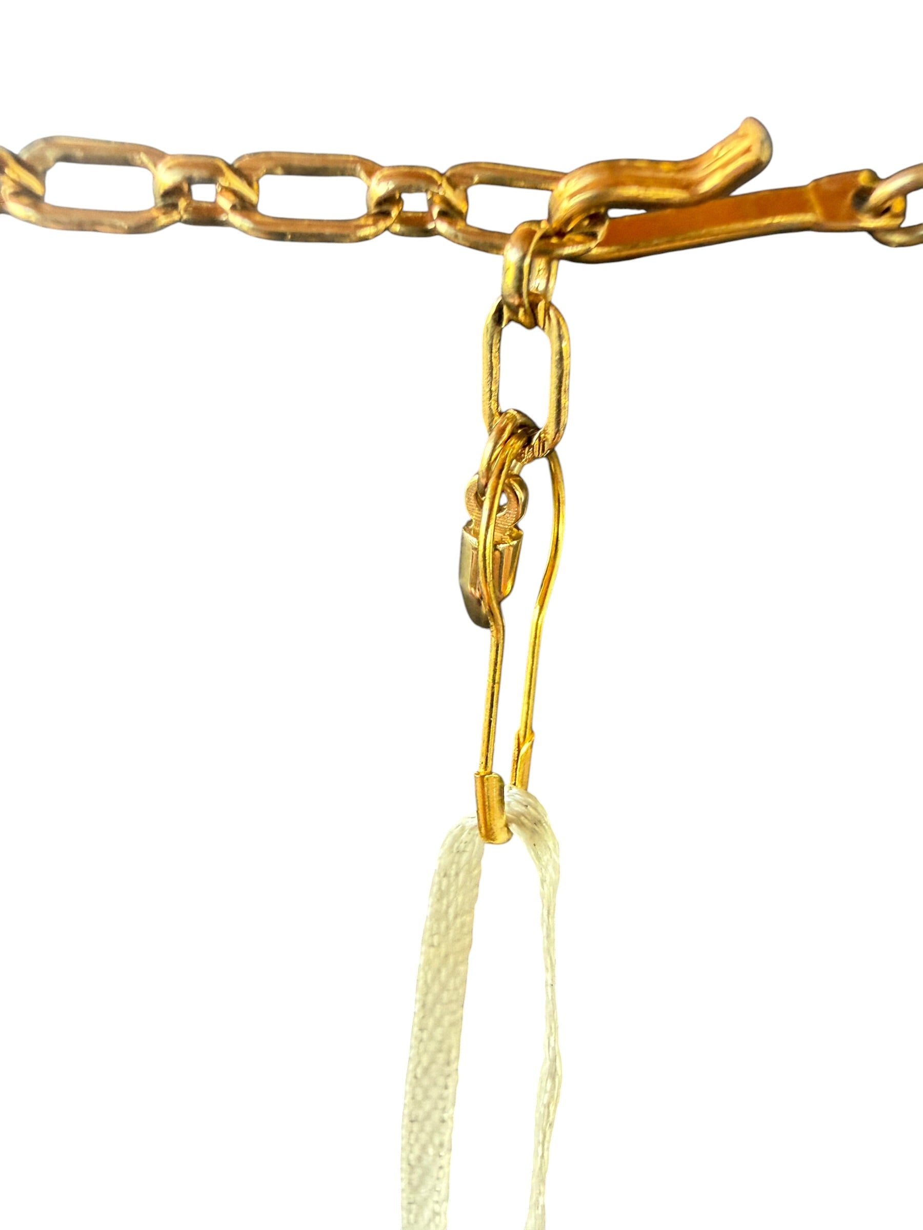Gold-Colored Metal Necklace with Triangular Pendant and Decorative Beads